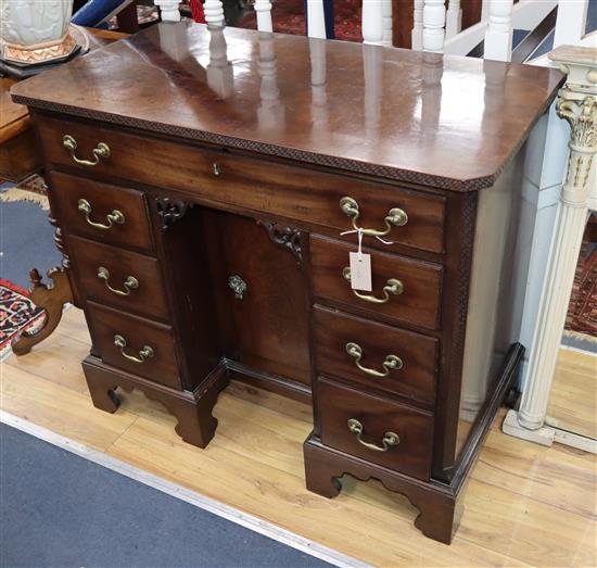 A George III mahogany kneehole desk W.96cm